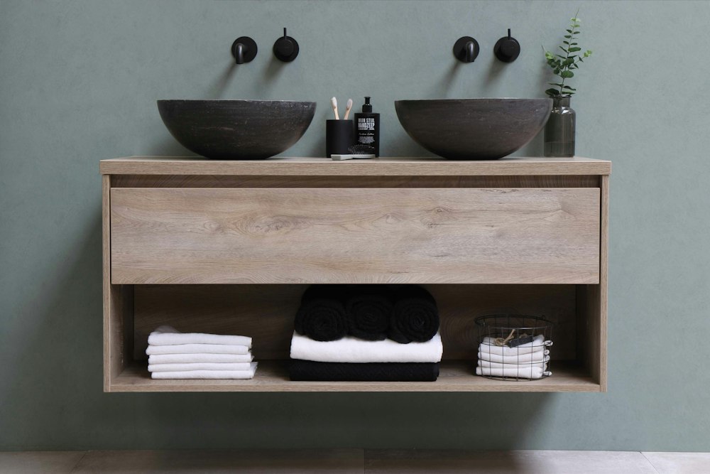 Floating timber vanity with twin vessel basins and wall-mounted taps